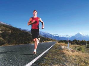 Man Jogging on Open Road